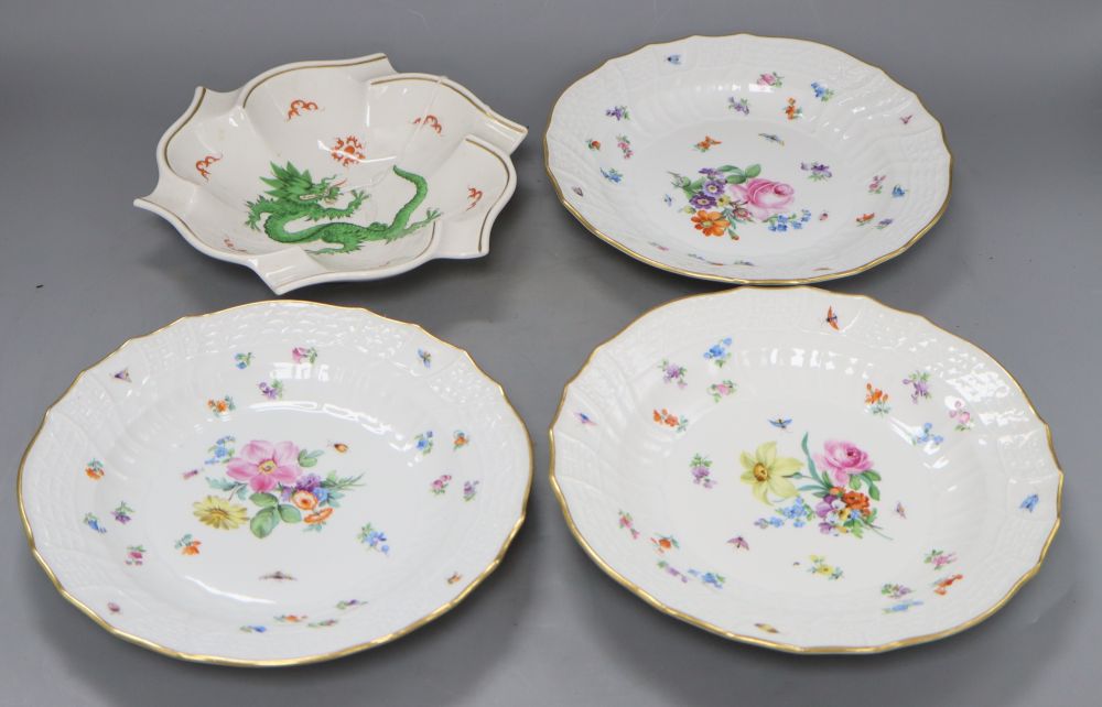 A set of three late Meissen plates with floral decoration and a modern Meissen dragon bowl